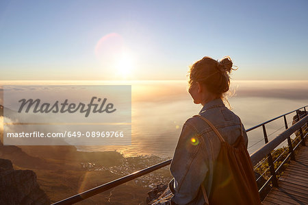 Young woman on top of Table Mountain, looking at view, Table Mountain, Cape Town, South Africa