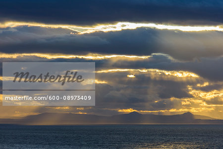 Firth of Forth with clouds and sunbeams at sunset at North Berwick in Scotland, United Kingdom