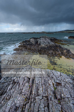 Scottish coast in spring with rain clouds over the ocean at Mallaig in Scotland, United Kingdom