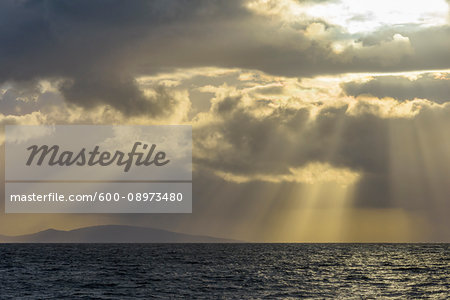 Scottish coast at sunset with sunrays at Mallaig in Scotland, United Kingdom