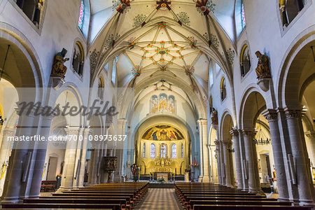 Interior of the Basilica of St Castor showing the aisle and nave with the intricate vaulted ceiling in Koblenz, Germany