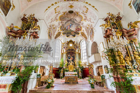 Orante alter and interior of the Roman Catholic church of Saints Peter and Paul Church in Mittenwald in Bavaria, Germany
