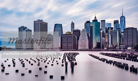 dramatic scenery of lower manhattan skyline in the evening on a cloudy day, longterm exposure