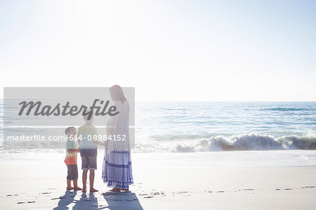 Mother and sons on beach, Cape Town, South Africa