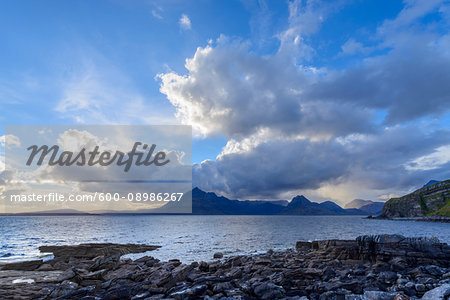 Scottish coast with dramatic clouds over Loch Scavaig on the Isle of Skye in Scotland, United Kingdom