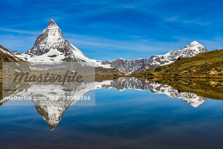 The Matterhorn reflected in Riffelsee Lake at Zermatt, Switzerland The Matterhorn reflected in Riffelsee Lake at Zermatt, Switzerland