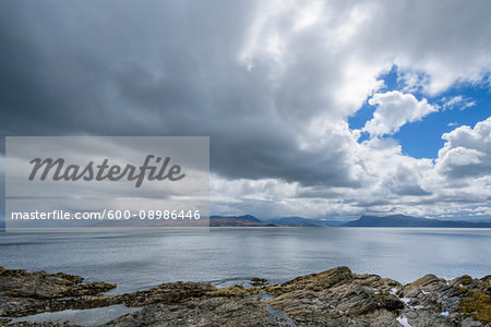 Scottish coast with rainclouds over the Sound of Sleat near Armadale on the Isle of Skye in Scotland, United Kingdom
