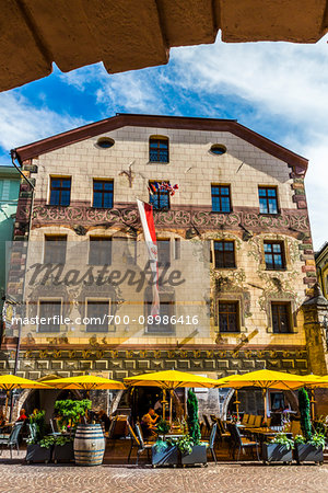 Restaurant with outdoor cafe on a sunny day in the resort town of Innsbruck, Austria