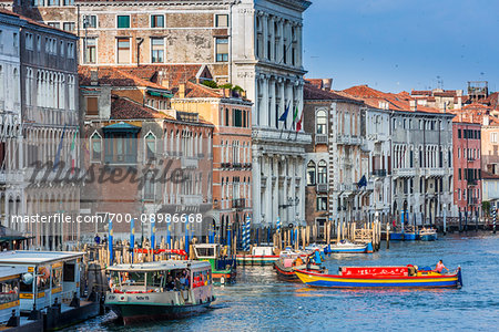 Boats travelling along the Grand Canal in the morning on a sunny day in Venice, Italy