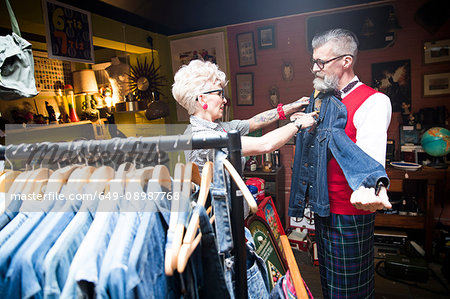Quirky vintage couple shopping in vintage and antique emporium