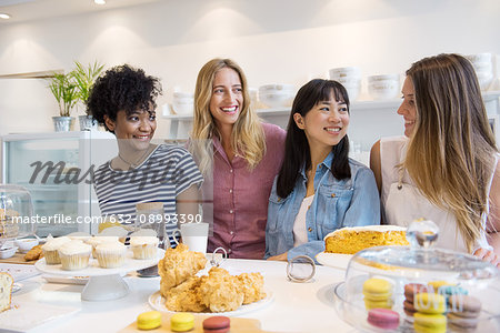 Young women smiling in bakery