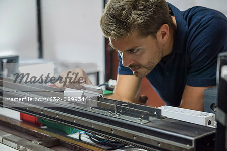 Engineer scrutinizing equipment