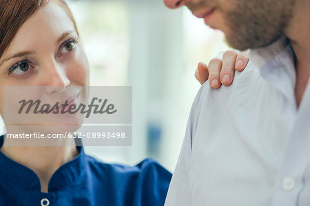 Healthcare worker reassuring patient