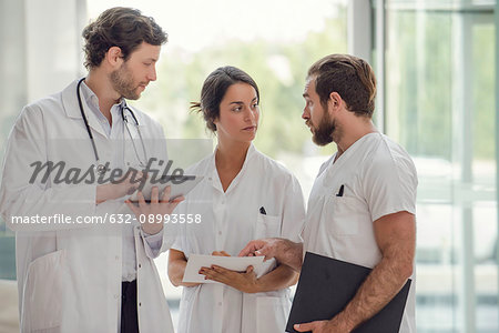 Healthcare workers conferring with each other