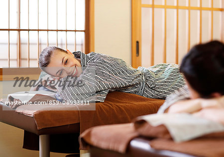 Caucasian woman getting a massage at a spa in Tokyo, Japan