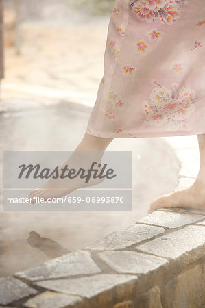 Japanese woman bathing at traditional hot spring, Tokyo, Japan