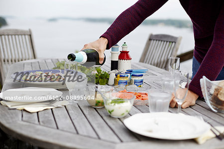 Man pouring champagne into glass