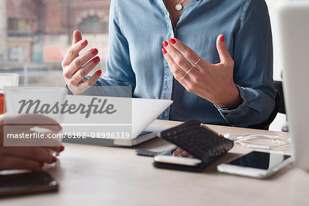 Woman gesturing during meeting