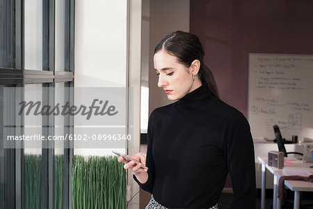 Young woman using cell phone