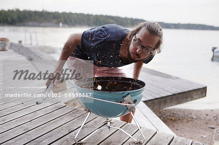 Man preparing grill