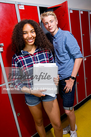 Portrait of teenage girl and teenage boy in school