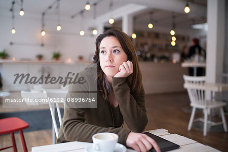 Thoughtful woman in cafe