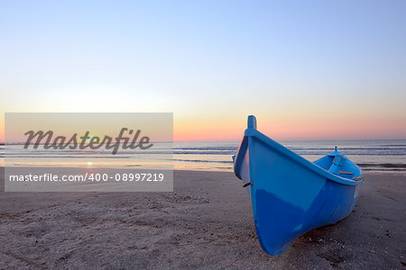 Fishing boat and sunrise at black sea