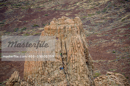 Rock climbers at famous La Cathedral multipitch climbing route. El Teide national park. Tenerife island, Spain.