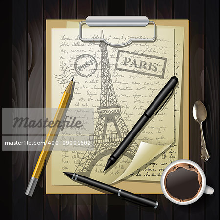 eiffel tower on white paper with pens and pancil on top of wooden table with coffee cup