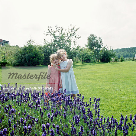 Two girls playing in garden