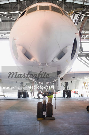 Aircraft worker checking airplane