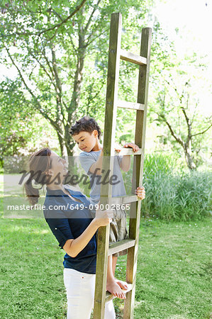 Mother and son playing with ladder