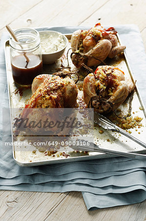 Tray of roasted stuffed chickens