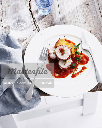 Plate of chicken involuntini with tomato
