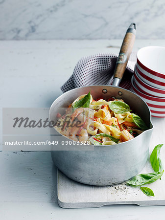 Pot of vegetable pasta on board