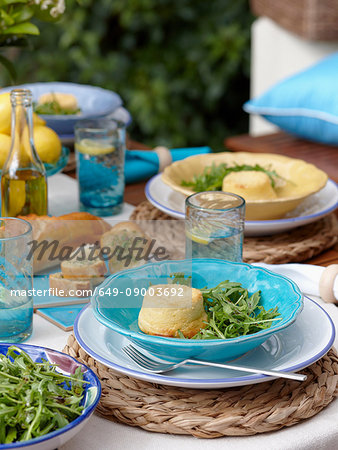 Plate of cheese souffle with salad