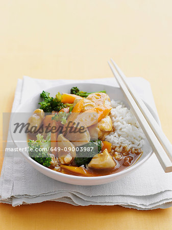Bowl of sweet and sour chicken with rice