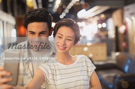 Young couple taking selfie