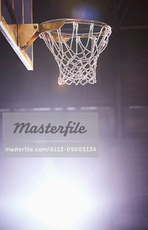 Lens flare around brightly lit basketball hoop