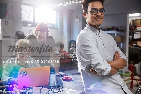 Portrait smiling, confident male designer in workshop