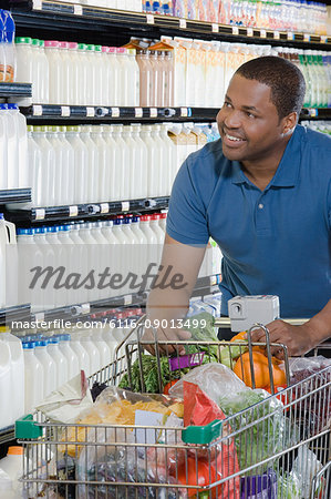 customer pushing a shopping trolley