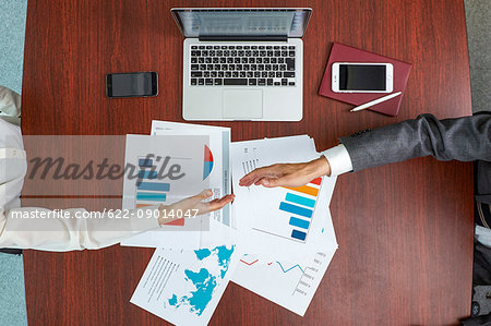 Top view of Japanese businesspeople talking in meeting room