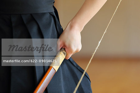 Japanese traditional archery athlete hand holding bow