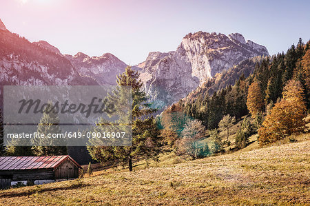 Sunlit field and mountain landscape, Bavaria, Germany Sunlit field and mountain landscape, Bavaria, Germany