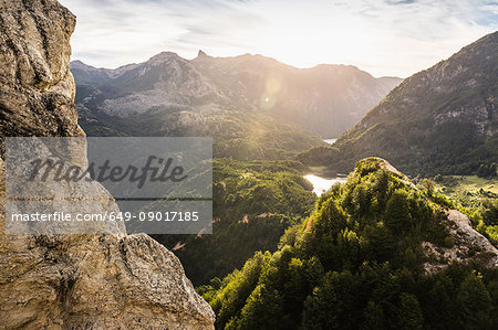Sunlit mountain valley landscape and rock formations,  Futaleufu, Los Lagos region, Chile