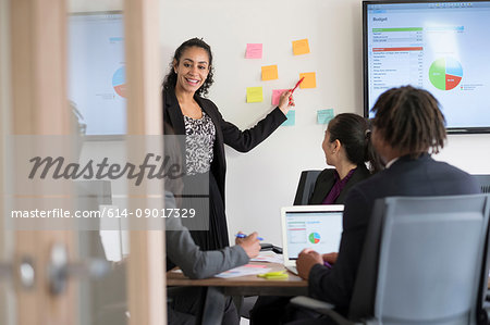 Businessman and businesswomen, in office, brainstorming