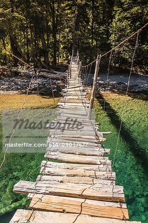 Wooden footbridge crossing river Azul, Cajon del Azul near El Bolson, Patagonia, Argentina
