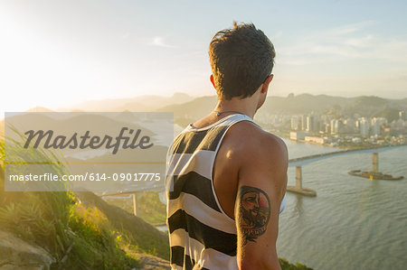 Man looking at view during sunset, Rio de Janeiro, Brazil
