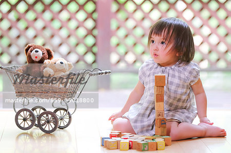 Mixed-race young girl with teddy bear