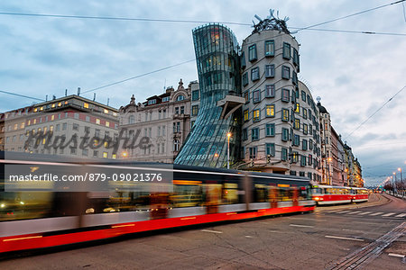 Tancici dum, Prague, Czech Republic The famous Tancici dum, in the modern district of Prague, photographed with moving bus